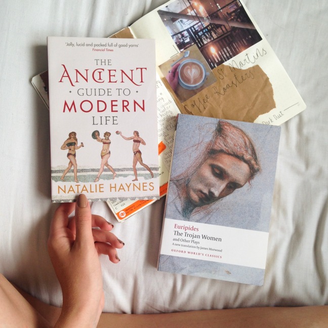 Flat lay, crossed legged showing two of my favourite books of 2018 so far - The Ancient Guide to Modern Life by Natalie Haynes and The Trojan Women by Euripides